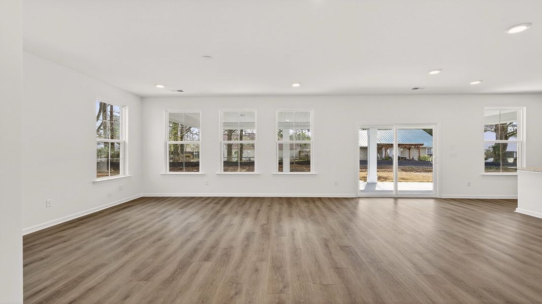 Spacious Pritchard living room with sliding glass door for easy outdoor access