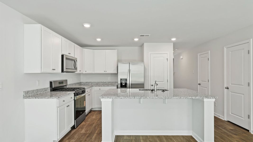 Furnished interior view inside a new home in Pine Hills Townhomes at Cane Bay, Summerville (Image 2).