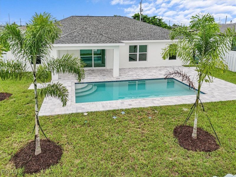 Front exterior of a new home in Cape Coral, Cape Coral, FL, highlighting curb appeal (Image 22). Front exterior of a new home in Cape Coral, Cape Coral, FL, highlighting curb appeal (Image 22).