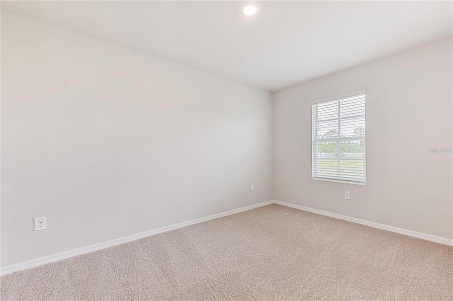 Spacious, unfurnished interior of a new home in Heritage Lake Park, Punta Gorda (Image 12).