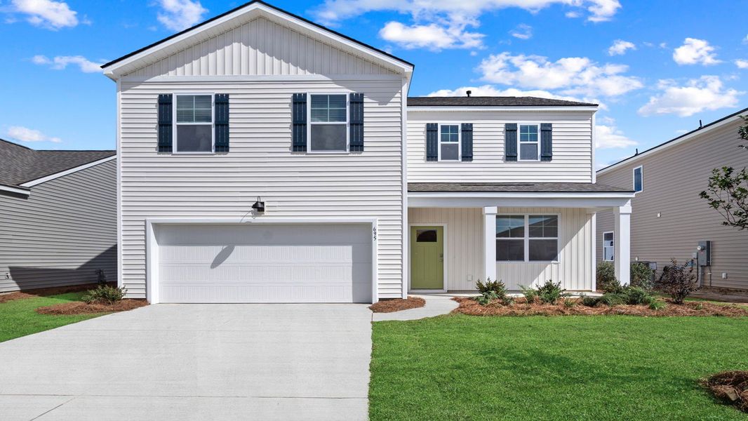 Front exterior of a new home in The Retreat at East Argent, Ridgeland, SC, highlighting curb appeal (Image 1). Front exterior of a new home in The Retreat at East Argent, Ridgeland, SC, highlighting curb appeal (Image 1).