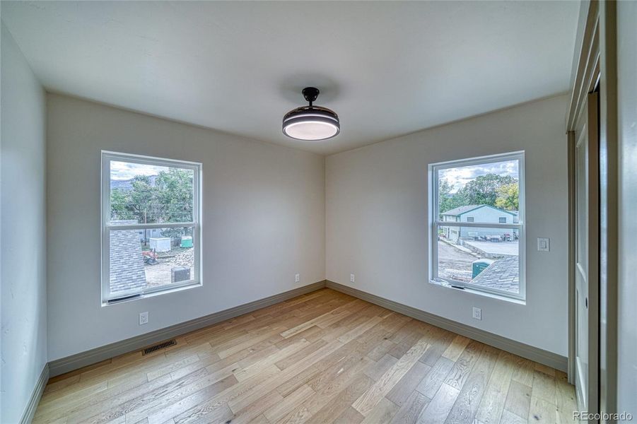 Bedroom #1. This light is also a ceiling fan with blades that come out.