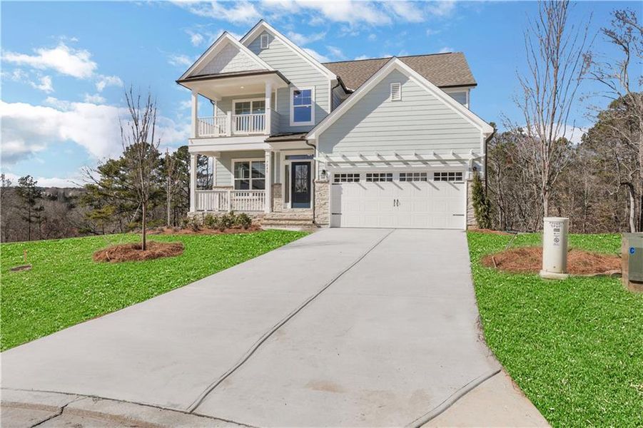 Front exterior of a new home in Cambridge, Flowery Branch, GA, highlighting curb appeal (Image 22). Front exterior of a new home in Cambridge, Flowery Branch, GA, highlighting curb appeal (Image 22).
