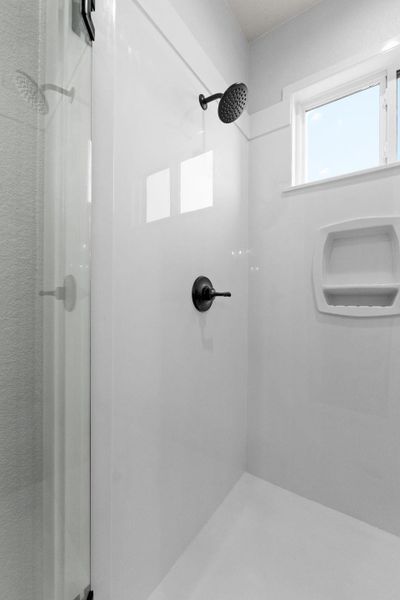 Full bath featuring a stall shower