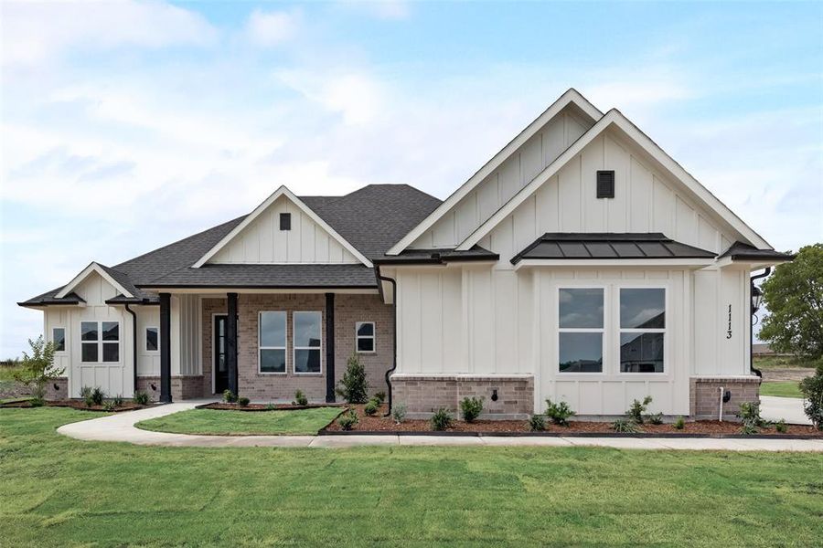 View of front of house with a front yard