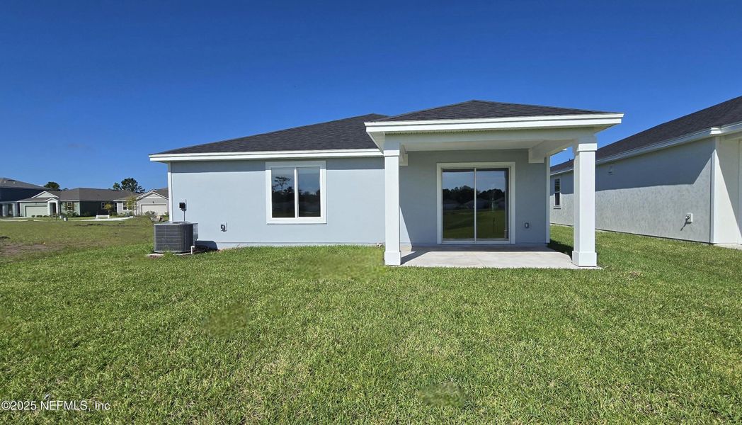 Exterior details and patio area of a home in Lakes at Bella Lago - Signature Series, Green Cove Springs (Image 2).