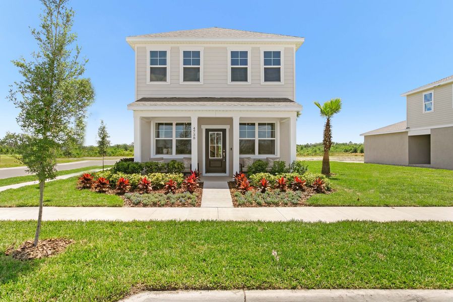 Front exterior of a new home in Brack Ranch, St. Cloud, FL, highlighting curb appeal (Image 27). Front exterior of a new home in Brack Ranch, St. Cloud, FL, highlighting curb appeal (Image 27).