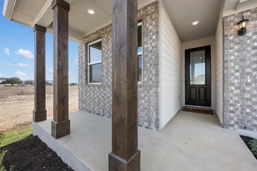 Exterior details and patio area of a home in Rolling Glen, Hutto (Image 3).