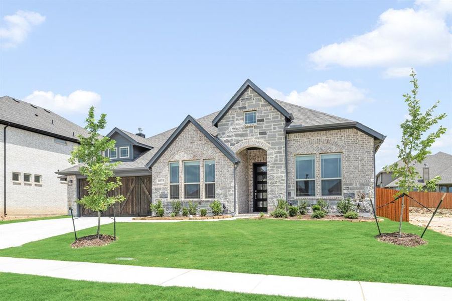 Front exterior of a new home in Villages of Walnut Grove, Midlothian, TX, highlighting curb appeal (Image 26).