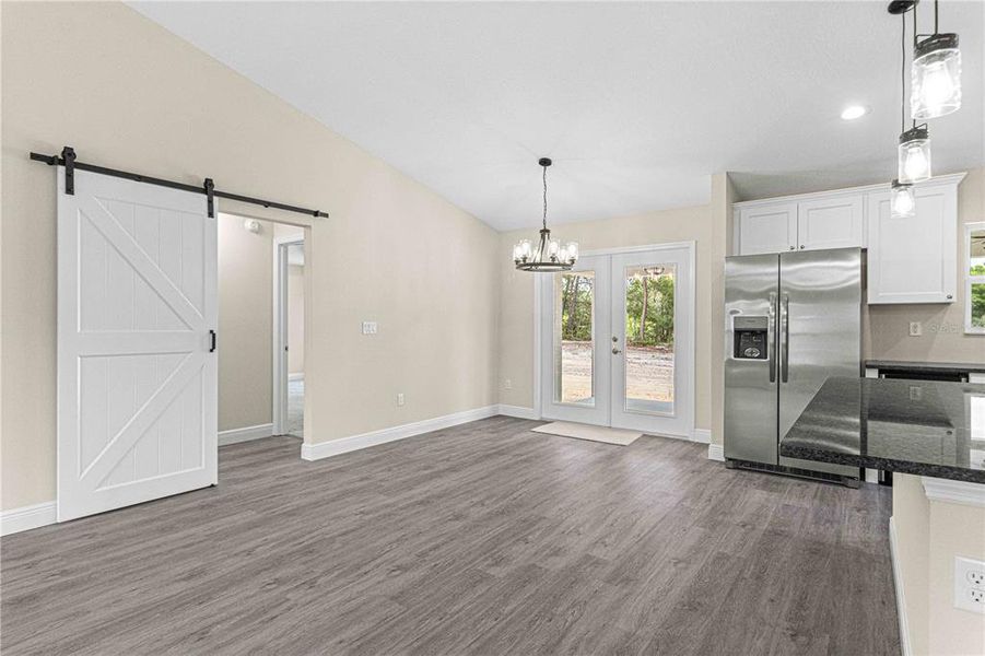 Barn door access to laundry room and primary suite