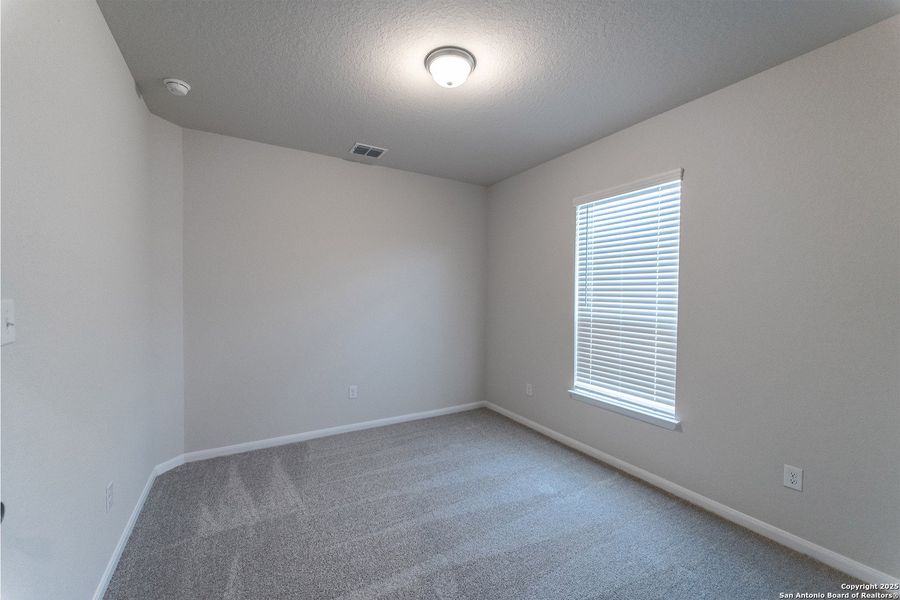 Spacious, unfurnished interior of a new home in The Woodlands at Medina Hills, Mico (Image 13).