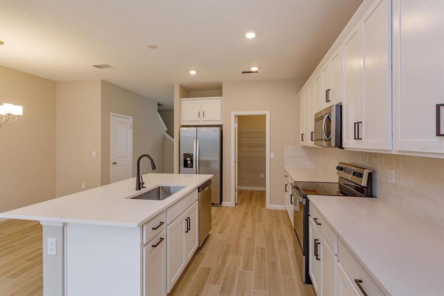 Furnished interior view inside a new home in Serenade at Ovation, Winter Garden (Image 6).