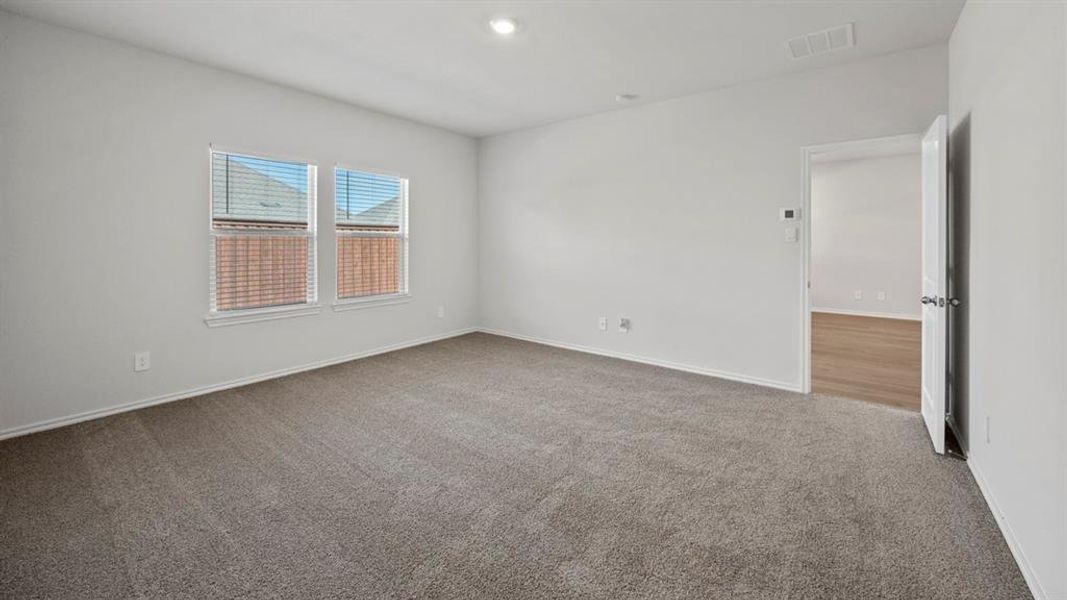 Unfurnished room featuring light colored carpet and recessed lighting