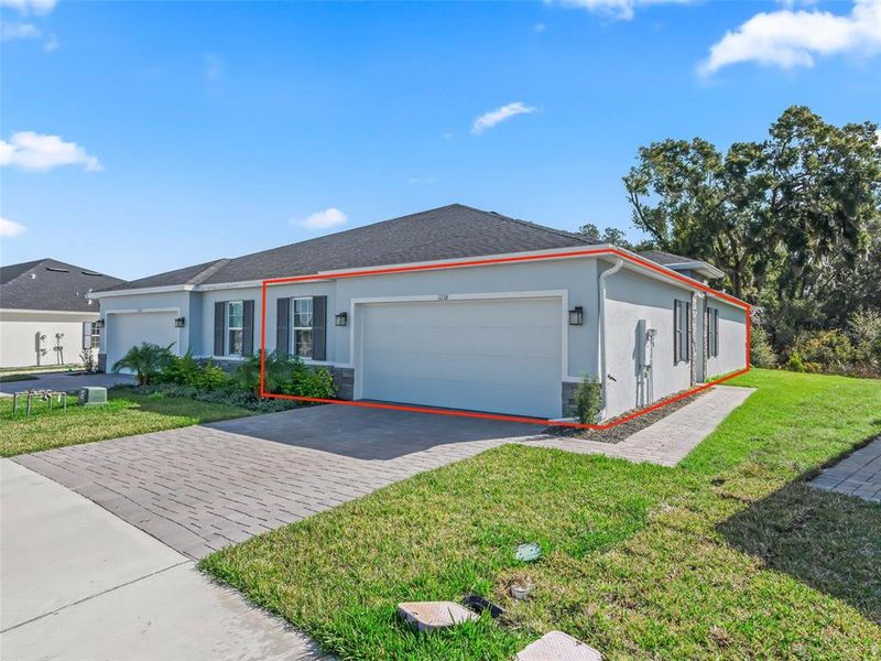 Front exterior of a new home in , Lady Lake, FL, highlighting curb appeal (Image 2). Front exterior of a new home in , Lady Lake, FL, highlighting curb appeal (Image 2).