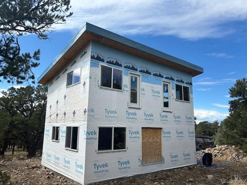 Main view of home with new Tyvek