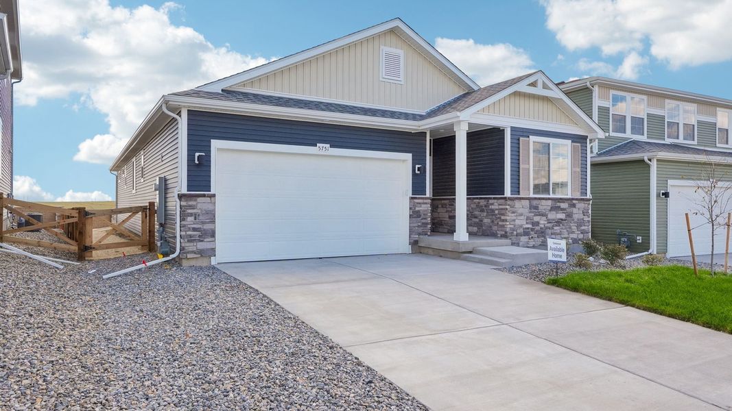 Front exterior of a new home in Banning Lewis Ranch, Colorado Springs, CO, highlighting curb appeal (Image 1). Front exterior of a new home in Banning Lewis Ranch, Colorado Springs, CO, highlighting curb appeal (Image 1).