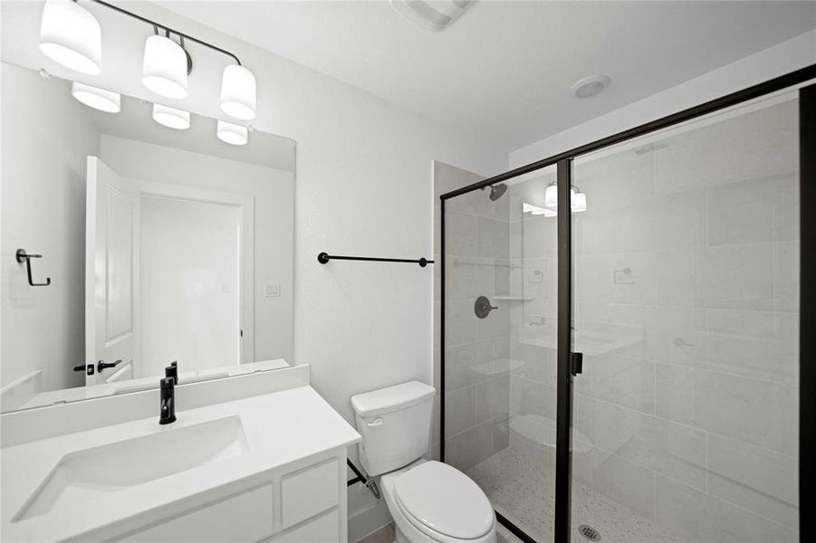 Full bathroom featuring vanity and a stall shower Full bathroom featuring vanity and a stall shower