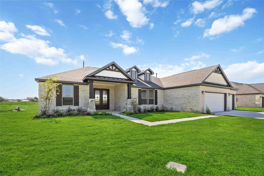 Front exterior of a new home in Blue Heron Estates, Beasley, TX, highlighting curb appeal (Image 17). Front exterior of a new home in Blue Heron Estates, Beasley, TX, highlighting curb appeal (Image 17).