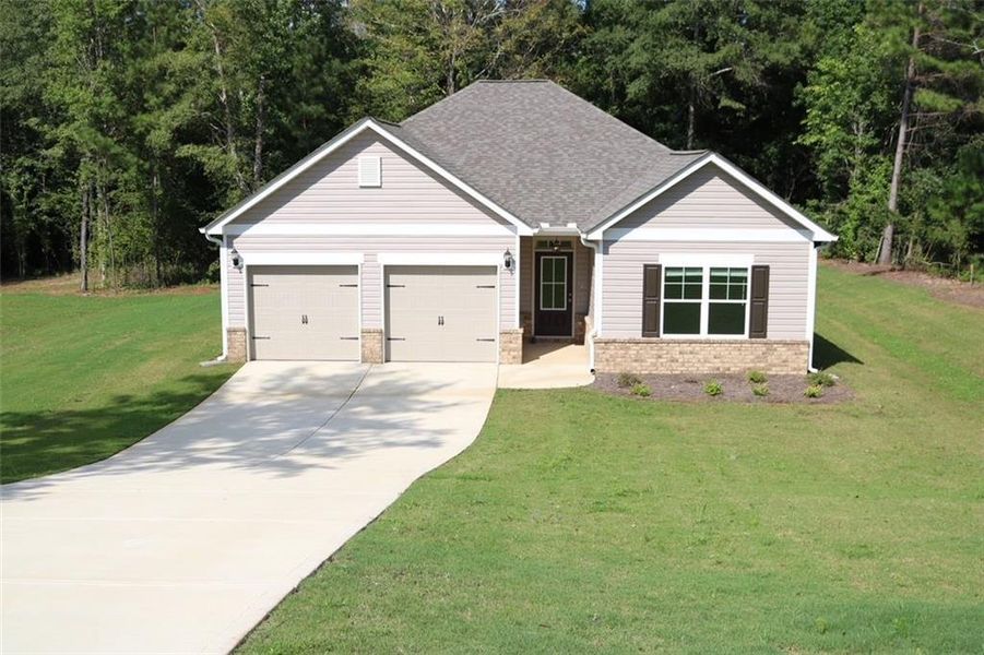 Front exterior of a new home in , Macon, GA, highlighting curb appeal (Image 2).