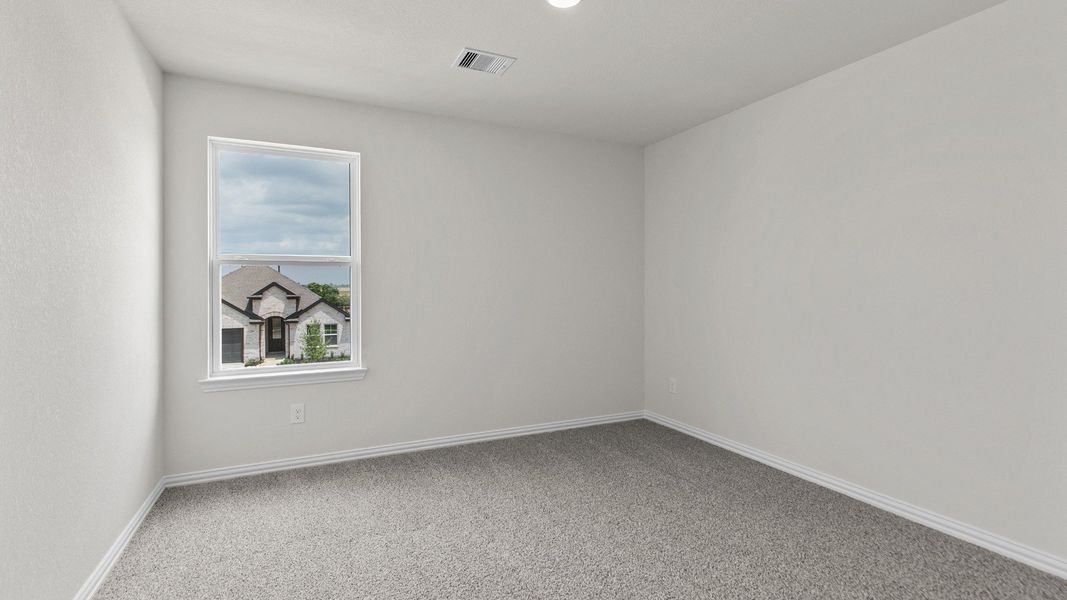 Representative furnished interior of a home built from the Southfork by Brightland Homes in Sunterra, Katy (Image 16).