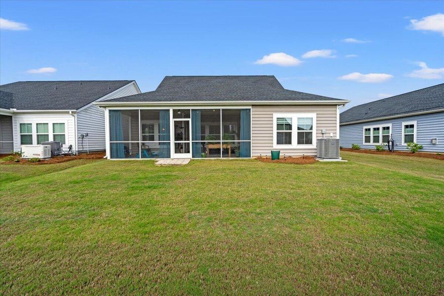 Exterior details and patio area of a home in Horizons at Summers Corner | 55+, Summerville (Image 26).