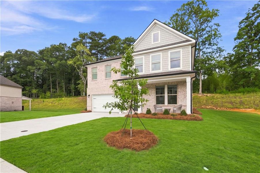 Front exterior of a new home in Hamilton Lakes, Lawrenceville, GA, highlighting curb appeal (Image 25).
