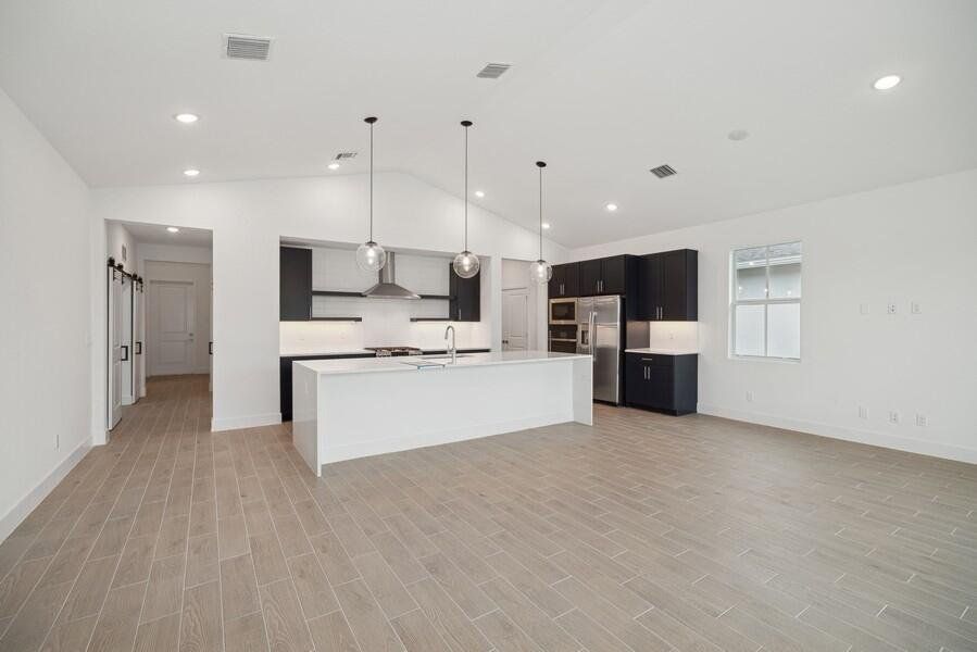 (Some or all of photography is of model or similar home and/or renderings and not necessarily indicative of available home). This home has white kitchen cabinets.