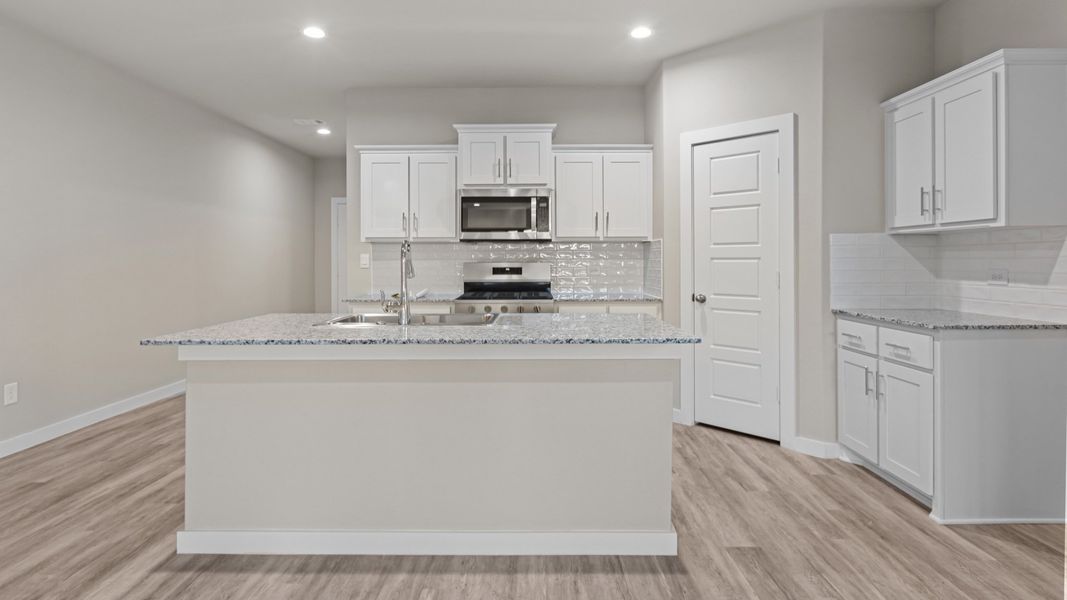 Representative furnished interior of a home built from the ROSEMONT by D.R. Horton in Homestead at Parks Bell Ranch, Odessa (Image 8).