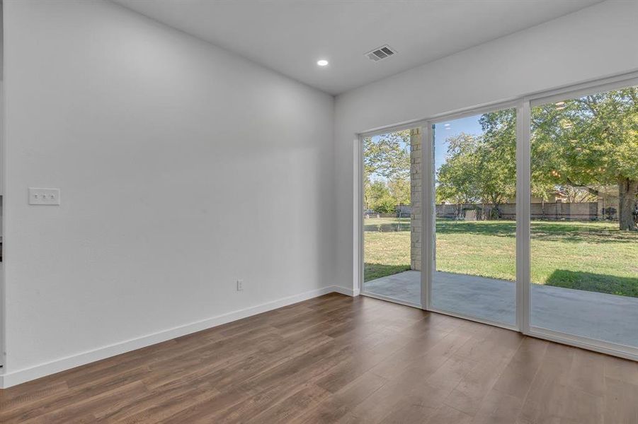 Unfurnished room with dark hardwood / wood-style flooring