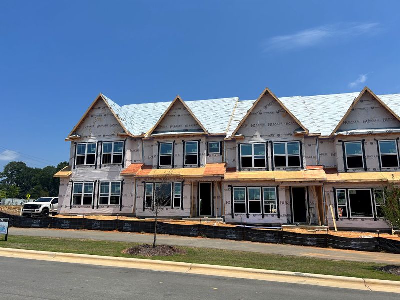 Front exterior of a new home in Atwater Station - Midtown Collection, Fuquay Varina, NC, highlighting curb appeal (Image 1). Front exterior of a new home in Atwater Station - Midtown Collection, Fuquay Varina, NC, highlighting curb appeal (Image 1).