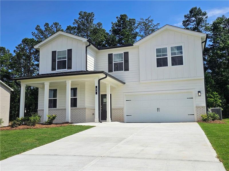 Front exterior of a new home in Hawthorne Reserve, Dallas, GA, highlighting curb appeal (Image 18).