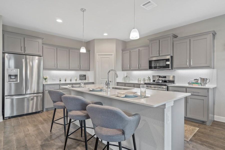 Kitchen-All Home and community information, including pricing, included features, terms, availability and amenities, are subject to change at any time without notice or obligation. All Drawings, pictures, photographs, video, square footages, floor plans, elevations, features, colors and sizes are approximate for illustration purposes only and will vary from the homes as built.