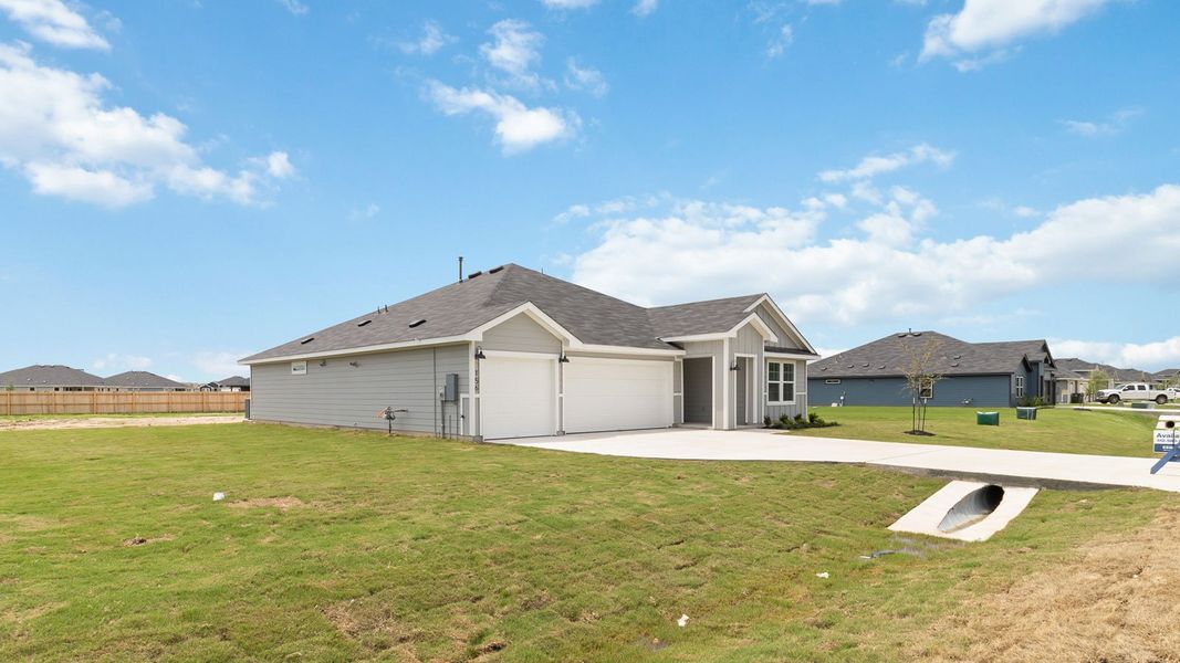 Front exterior of a new home in Railhead, Cedar Creek, TX, highlighting curb appeal (Image 2). Front exterior of a new home in Railhead, Cedar Creek, TX, highlighting curb appeal (Image 2).