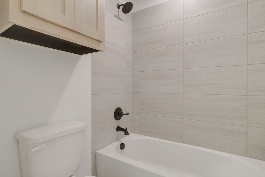 Representative furnished interior of a home built from the Longview by Graham Hart Home Builder in Bear Ridge, Burleson (Image 7).