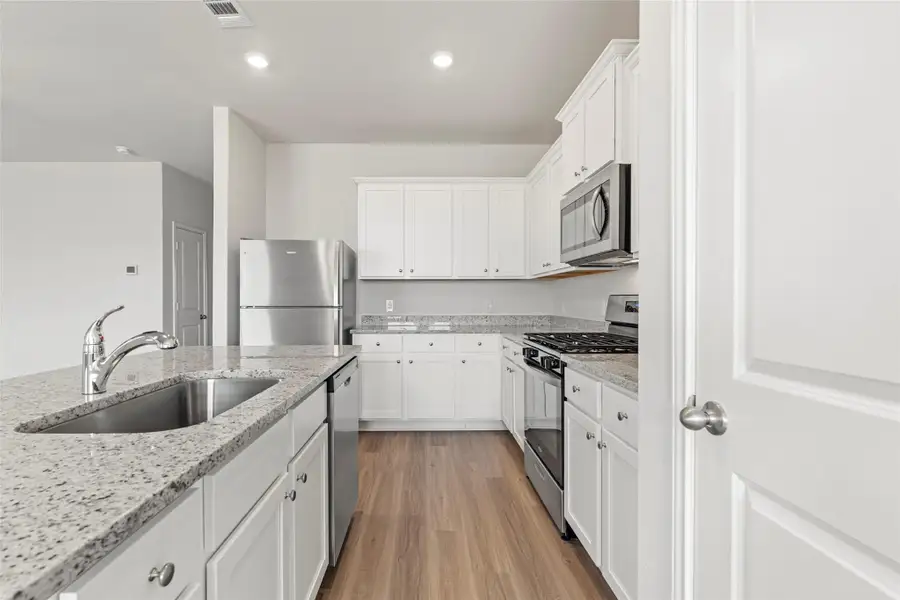 Furnished interior view inside a new home in Canterra Creek, Iowa Colony (Image 4).