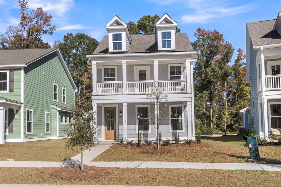 Front exterior of a new home in Sweetgrass Station, Summerville, SC, highlighting curb appeal (Image 24).