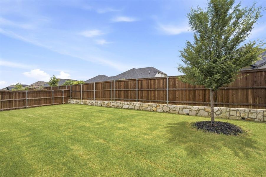 Large fenced backyard with covered patio and plenty of room to play, garden, entertain, or add future outdoor living. A rare yard size buyers will notice.