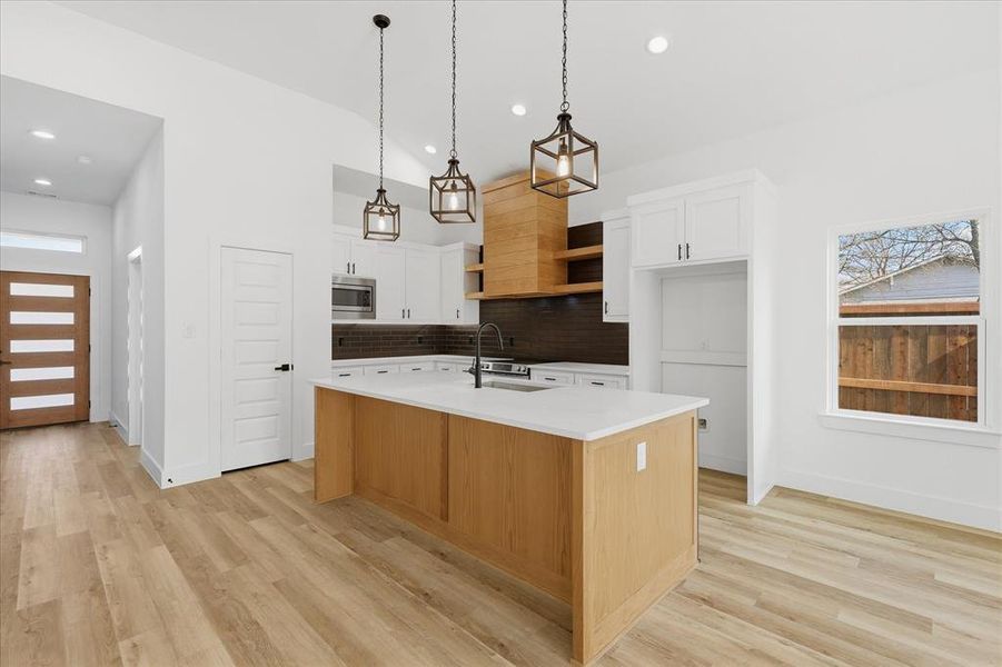 Vaulted ceiling throughout kitchen and living area