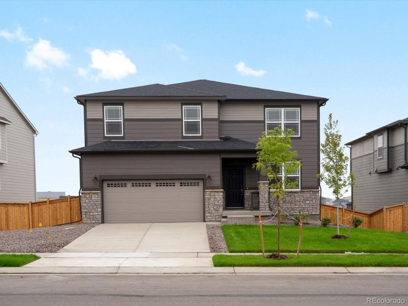 Front exterior of a new home in Buffalo Highlands: The Canyon Collection, Commerce City, CO, highlighting curb appeal (Image 18). Front exterior of a new home in Buffalo Highlands: The Canyon Collection, Commerce City, CO, highlighting curb appeal (Image 18).