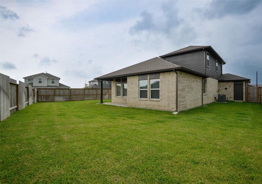 Front exterior of a new home in River Ranch Meadows, Dayton, TX, highlighting curb appeal (Image 18). Front exterior of a new home in River Ranch Meadows, Dayton, TX, highlighting curb appeal (Image 18).
