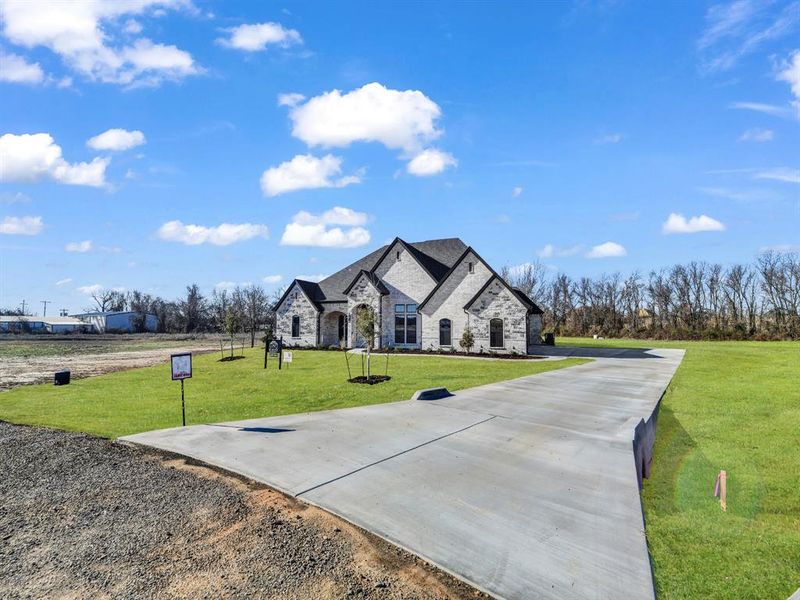 Front exterior of a new home in , Weatherford, TX, highlighting curb appeal (Image 24).