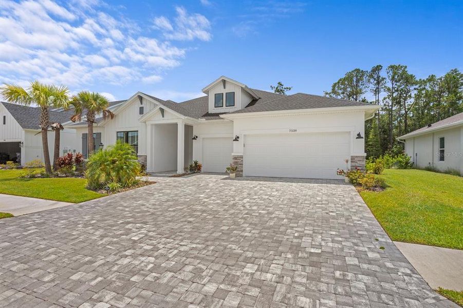 Front exterior of a new home in , Odessa, FL, highlighting curb appeal (Image 1).