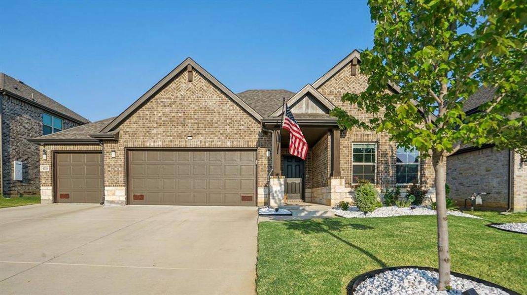 Front exterior of a new home in Sycamore Cove, Hickory Creek, TX, highlighting curb appeal (Image 25).
