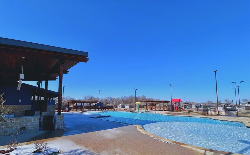 Community pool with a patio Community pool with a patio