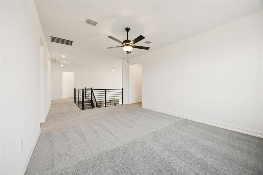 Spacious game room on second level. *Model representation.