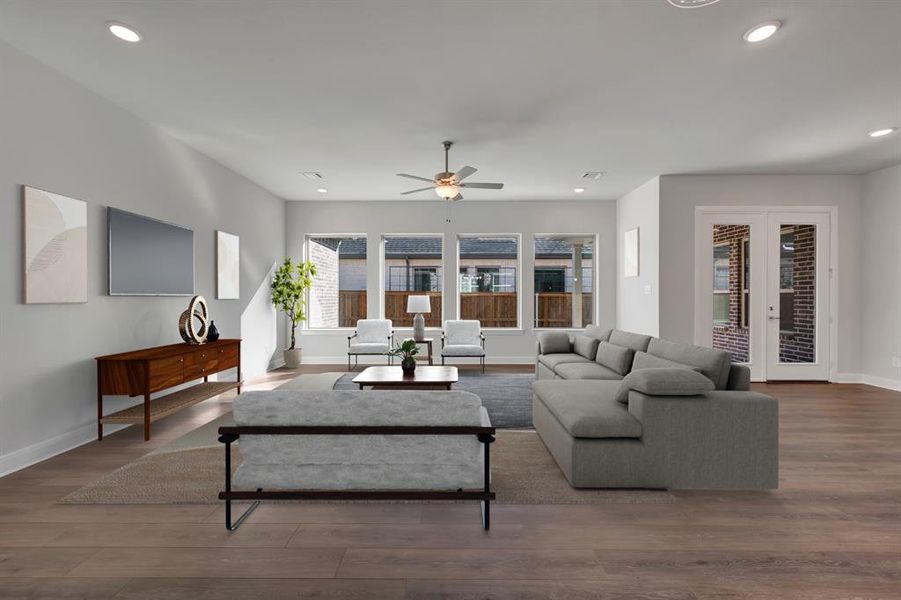 Living area with wood finished floors, french doors, ceiling fan, and recessed lighting