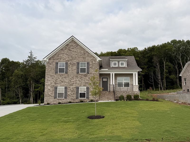 Front exterior of a new home in Patterson, Smyrna, TN, highlighting curb appeal (Image 18). Front exterior of a new home in Patterson, Smyrna, TN, highlighting curb appeal (Image 18).