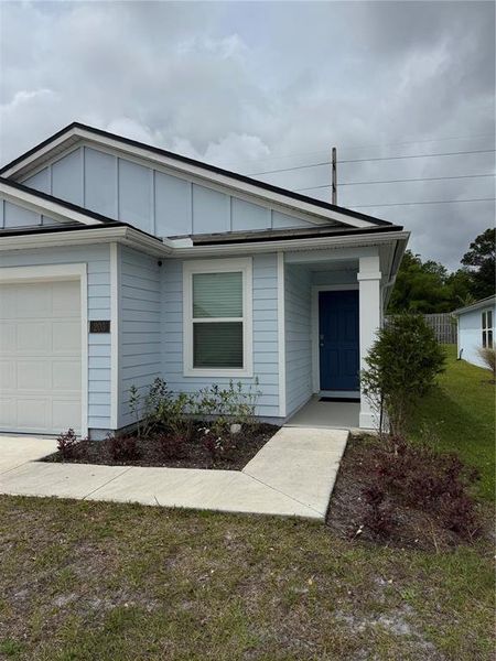 Front exterior of a new home in Ravenswood Village, St. Augustine, FL, highlighting curb appeal (Image 21).