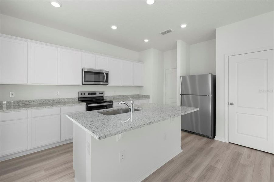Furnished interior view inside a new home in Peach Crossings, Winter Haven (Image 8).