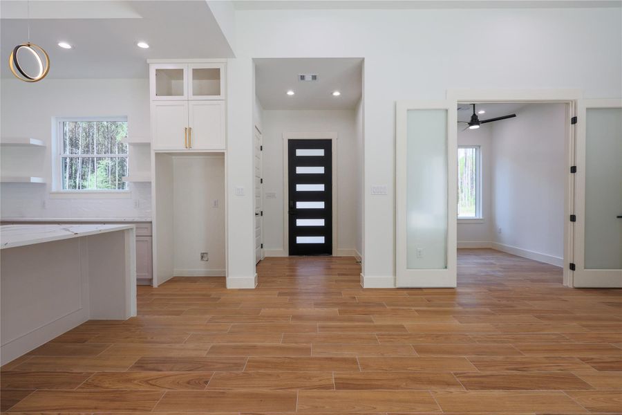 Foyer with entry closet walking into you 13ft tall ceilings!
